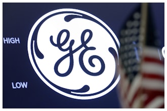 In this June 26, 2018, file photo the General Electric logo appears above a trading post on the floor of the New York Stock Exchange.