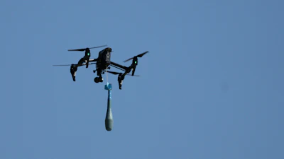 A drone carries a mortar shell as soldiers take part in the U.S.-led Immediate Response 25 military exercise in Petrochori, Greece, Wednesday, June 4, 2025.