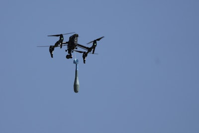 A drone carries a mortar shell as soldiers take part in the U.S.-led Immediate Response 25 military exercise in Petrochori, Greece, Wednesday, June 4, 2025.