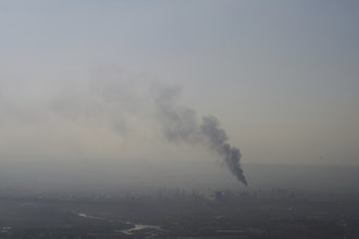 Smoke billows after an Iranian missile struck an oil refinery in Haifa, northern Israel, early Monday, June 16, 2025.