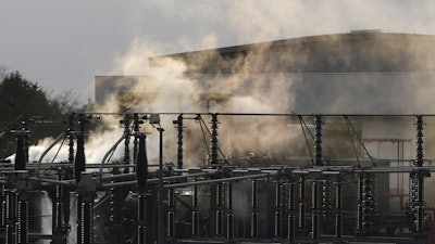 Smoke rises from the North Hyde electrical substation, which caught fire last night, leading to the closure of the Heathrow Airport, in London, March 21, 2025.