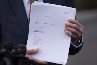 Energy Secretary Chris Wright holds a report concerning U.S. exports of liquefied natural gas (LNG) as he speaks to reporters at the White House in Washington, on March 19, 2025.