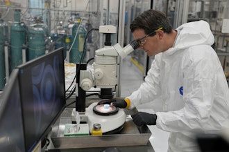 Taylor Duffin, of TRISO-X, a subsidiary of X-Energy, looks at a sample of TRISO fuel through a microscope Friday, June 27, 2025, in Oak Ridge, Tenn.