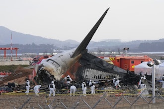 Rescue team members work at the site of a plane crash at Muan International Airport in Muan, South Korea on Dec. 31, 2024.