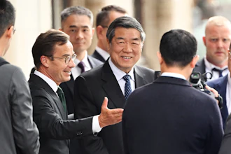 Swedish prime minister Ulf Kristersson, center left, gestures as he greets Chinese vice prime minister He Lifeng, center, at Rosenbad before trade talks between the US and China in Stockholm, Sweden, July 28, 2025.