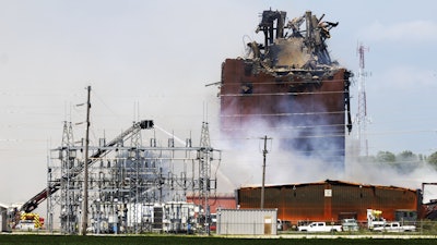 Firefighters battle a fire after an explosion in an industrial area in Fremont, Neb., Tuesday, July 29, 2025.