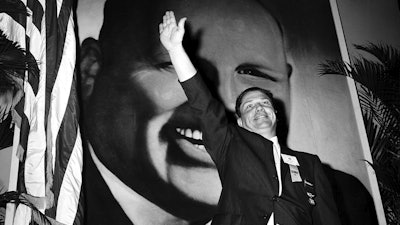 In this Sept. 30, 1957, file photo Jimmy Hoffa, Teamsters vice president and leading candidate to succeed Dave Beck as the IBT's new president, waves to delegates at the opening of the Teamsters Union convention at Miami Beach, Fla.