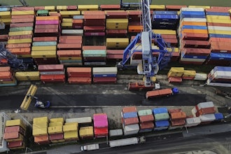 Containers are piled up in a cargo terminal in Frankfurt, Germany, Aug. 1, 2025.