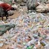 A scavenger sorts out plastic waste at a dumpsite on the outskirts of Lagos, Nigeria, Monday, Aug 11, 2025.