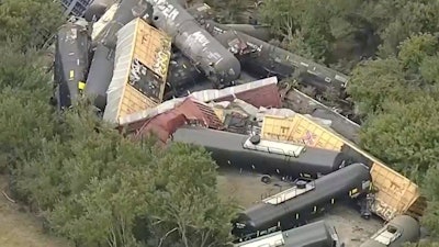 In this image from video by WFAA, train cars are piled up off the track after a derailment near Gordon, Texas, Aug. 12, 2025.