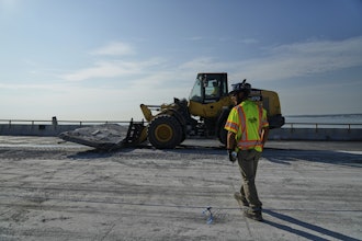 A demolition crew removes a slab of concrete from the remaining portions of the Francis Scott Key Bridge, Wednesday, July 30, 2025, in Baltimore.