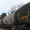 This image provided by the Howard Center for Investigative Journalism shows a train carrying tank cars, some containing hazardous materials, traveling across a railroad bridge in Paulsboro, N.J., on March 20, 2025, that was the site of a derailment and spill of toxic vinyl chloride in 2012.