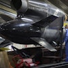Workers inspect a Flamingo cruise missile at Fire Point's secret factory in Ukraine on Monday, Aug. 18, 2025.