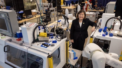 Dawn Tilbury in the SMART 4.0 Lab in the Ford Robotics Building at U-M. This equipment will help test digital twin software developed through the new center.