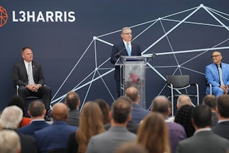 L3Harris Technologies Chair and CEO Christopher E. Kubasik speaks at the opening of the 94,000-square-foot satellite integration and test facility.