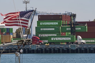 Shipping containers sit stacked at the Evergreen terminal at the port of Los Angeles, Friday, Aug. 1, 2025.