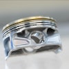 The pictured automotive piston was additively manufactured using the ORNL-developed DuAlumin-3D alloy.