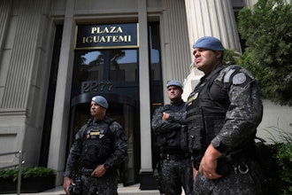 Police stand guard in front of a building in Sao Paulo, Aug. 28, 2025.
