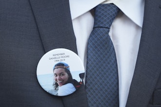A family member wears a photo of a Boeing crash victim Danielle Moore before a hearing at federal court in Fort Worth, Texas, Wednesday, Sept. 3, 2025.