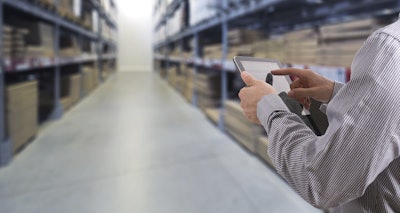 Businessman Stock Room Tablet 000063269441 Large
