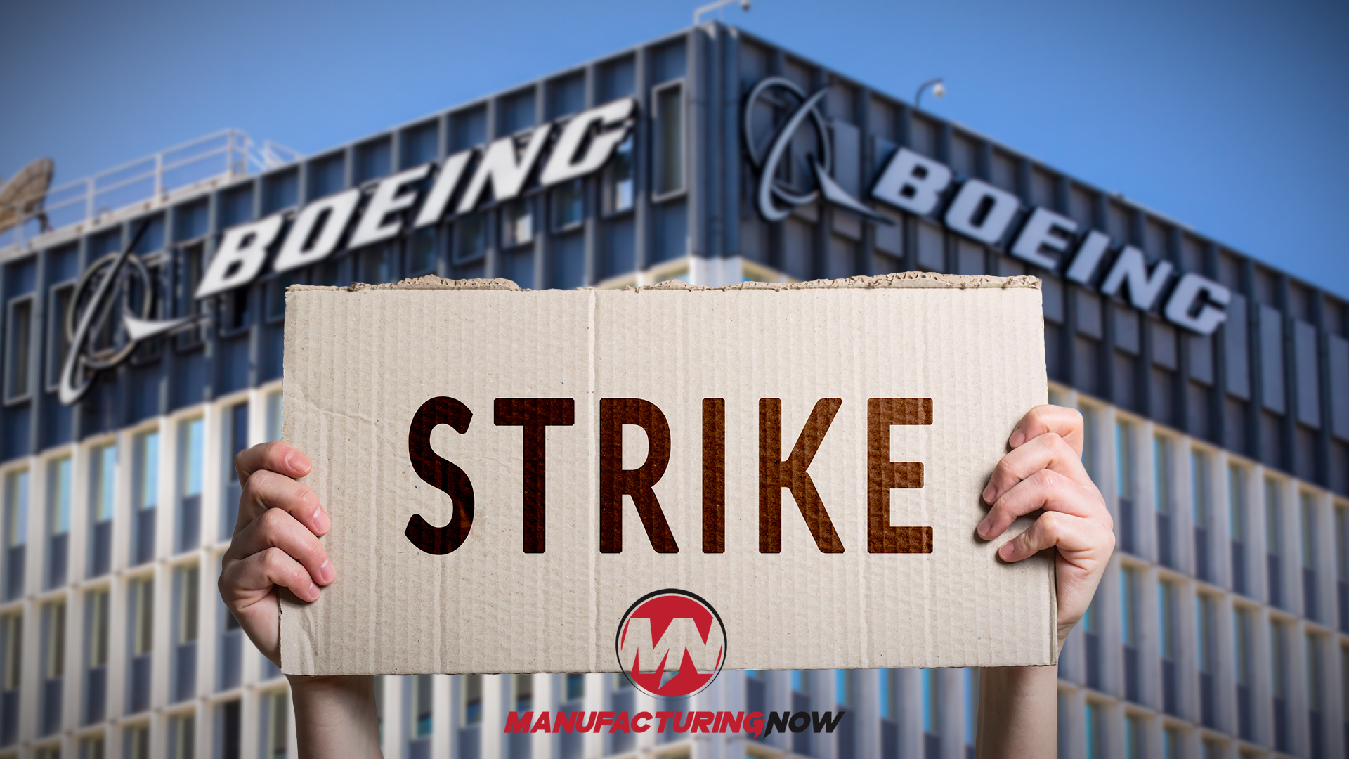 Boeing building with hands holding 'STRIKE' cardboard sign during labor protest