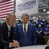 Euisun Chung, Executive Chair, Hyundai Motor Company, left, stands with Georgia Gov. Brian Kemp as Chung signs an IONIQ 9 EV vehicle during a media tour and grand opening at the Hyundai Motor Group Metaplant America, March 26, 2025, in Ellabell, Ga.
