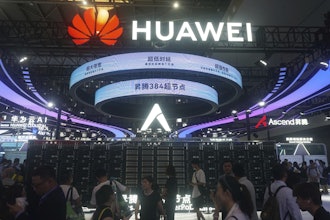 Visitors pass by the Huawei Atlas 900 A3 SuperPoD exhibited at the World Artificial Intelligence Conference in Shanghai, China, July 28, 2025.