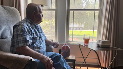 Buddy McCartney watches hundreds of trucks pass by his home in Holly Ridge, La., on their way to what will become Meta's largest data center, Monday, Aug. 18, 2025.