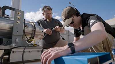 Firehawk technicians set up rocket equiptment.
