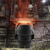 A giant ladle glows red after pouring molten iron in to a vessel inside the basic oxygen furnace as part of the processes of making steel at the U.S. Steel Granite City Works facility Thursday, June 28, 2018, in Granite City, Ill.