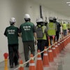 This image from video provided by U.S. Immigration and Customs Enforcement via DVIDS shows manufacturing plant employees being escorted outside the Hyundai Motor Group’s electric vehicle plant, Thursday, Sept. 4, 2025, in Ellabell, Ga.