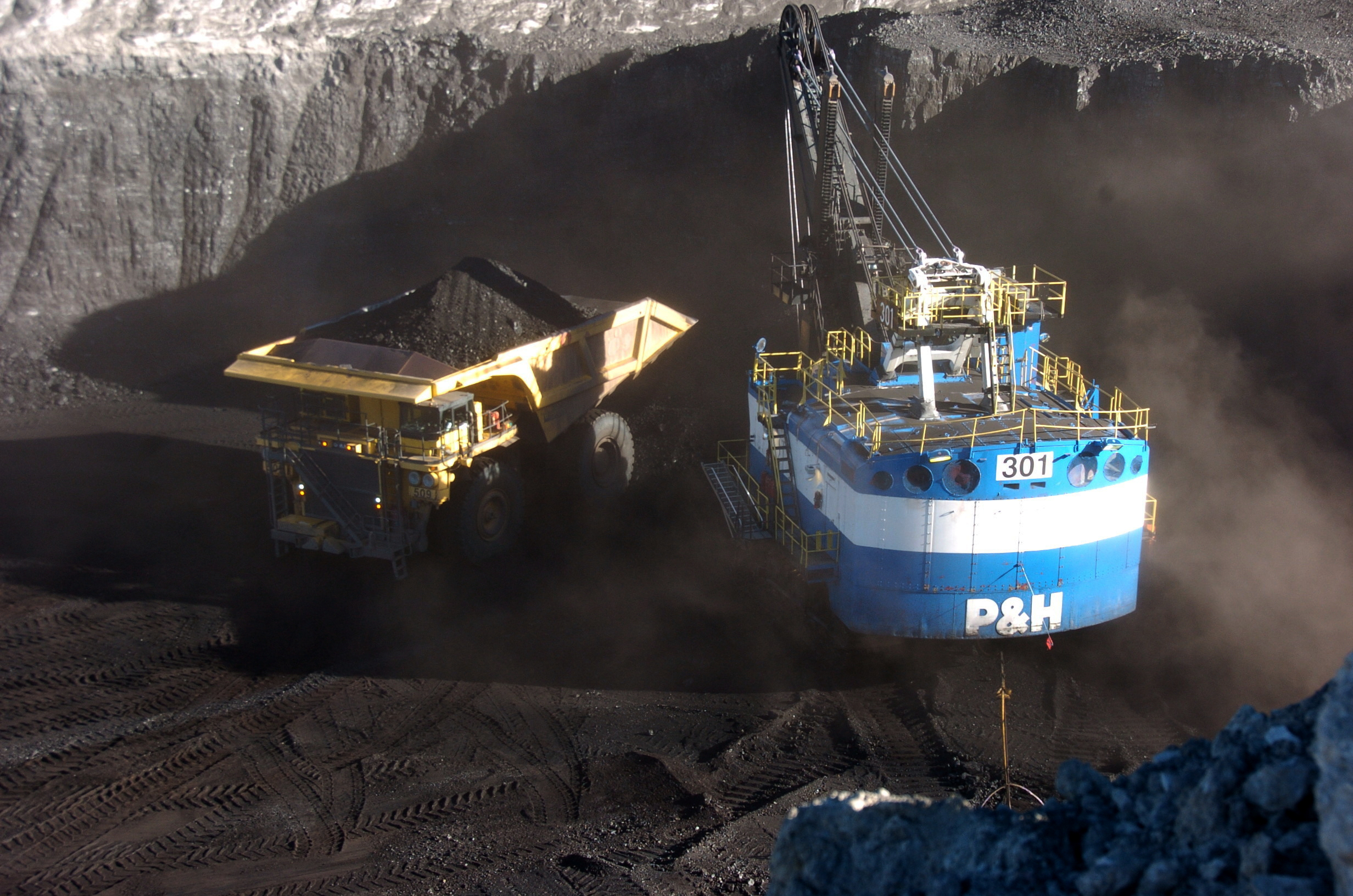 A haul truck is seen after being loaded with coal by a mechanized shovel at the Spring Creek mine, in this Nov. 15, 2016 photo, near Decker, Mont.