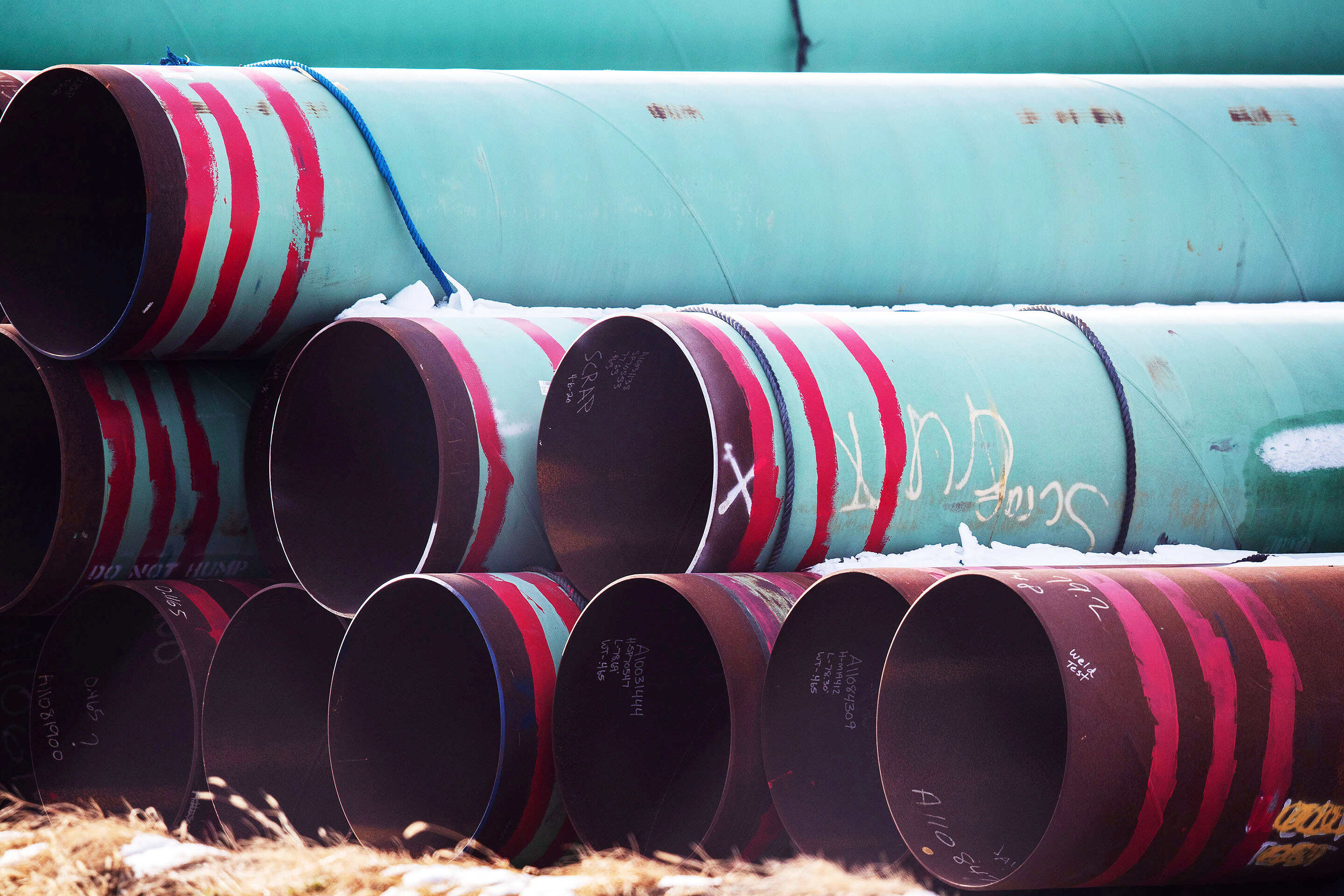 Pipes meant for the Keystone XL pipeline are stored in a field near Dorchester, Neb., Dec. 18, 2020.