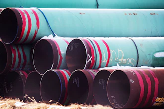 Pipes meant for the Keystone XL pipeline are stored in a field near Dorchester, Neb., Dec. 18, 2020.