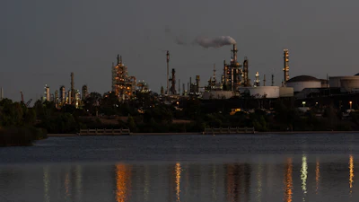 Lights from the Phillips 66 Los Angeles Refinery Wilmington Plant are reflected in the water at dusk, Thursday, Oct. 2, 2025, in Los Angeles.