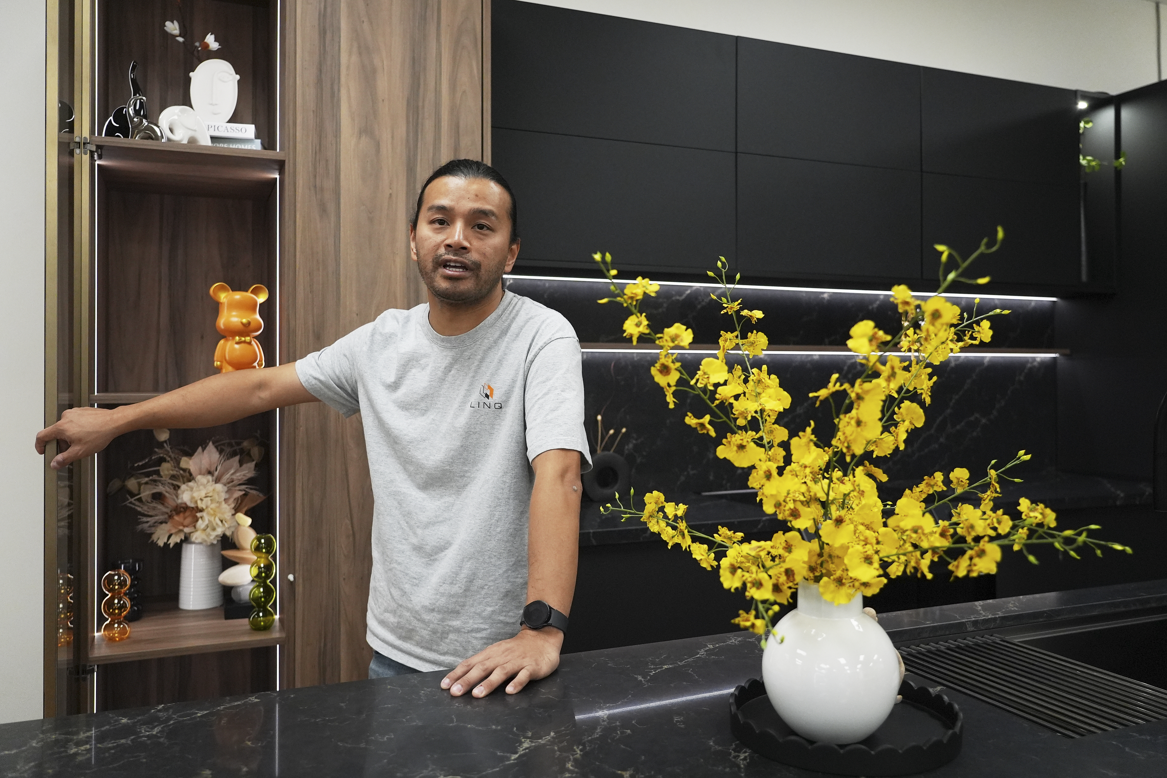 Josh Qian, co-founder of Linq Kitchen, a designer and maker of kitchen cabinets, shows his company's show room and warehouse in City of Industry, Calif., Friday, Oct. 10, 2025.