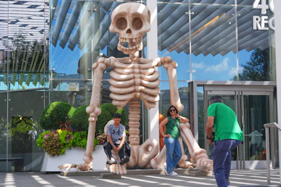 Sam Desai, right, takes a Halloween-themed photo of his wife, Sonia Desai, and son, Rishan Desai, in downtown Dallas, Sept. 27, 2025.