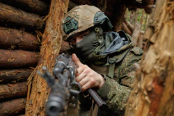 In this photo taken and distributed by Russian Defense Ministry Press Service on Monday, Oct. 6, 2025, a Russian soldier attends a combat training at one of the training grounds of the Moscow Military District.
