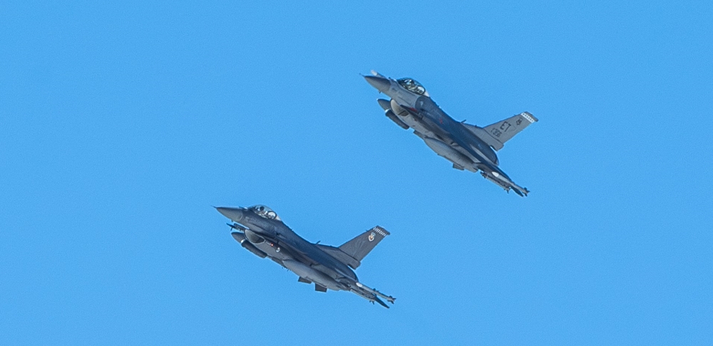 Two U.S. Air Force jets equipped with IVEWS and SABR fly at Nellis Air Force Base, Nevada.