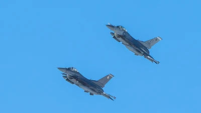Two U.S. Air Force jets equipped with IVEWS and SABR fly at Nellis Air Force Base, Nevada.