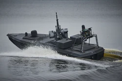 Ukraine's Security Service officers stand by Sea Baby drones, during a demonstration at an undisclosed location in Ukraine Friday, Oct. 17, 2025.
