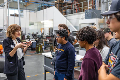 Scientific Cutting Tool's Sarah Christopher Falk speaks to a group of students.