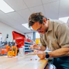 OSU researcher Devin Roach in the lab