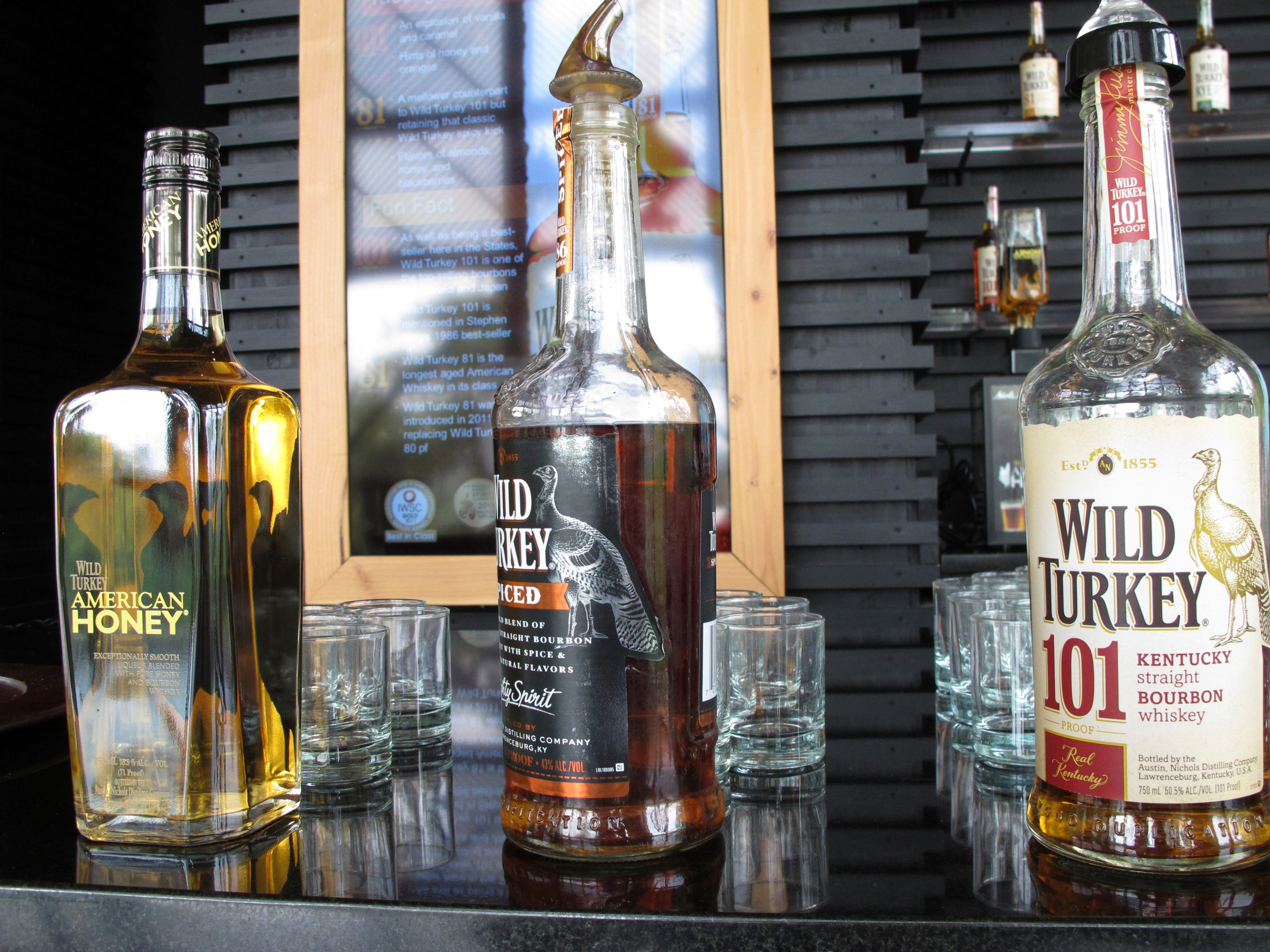 In this Aug. 22, 2014, file photo, Wild Turkey sampling bottles sit on the bar at the distillery's visitors' center near Lawrenceburg, Ky.