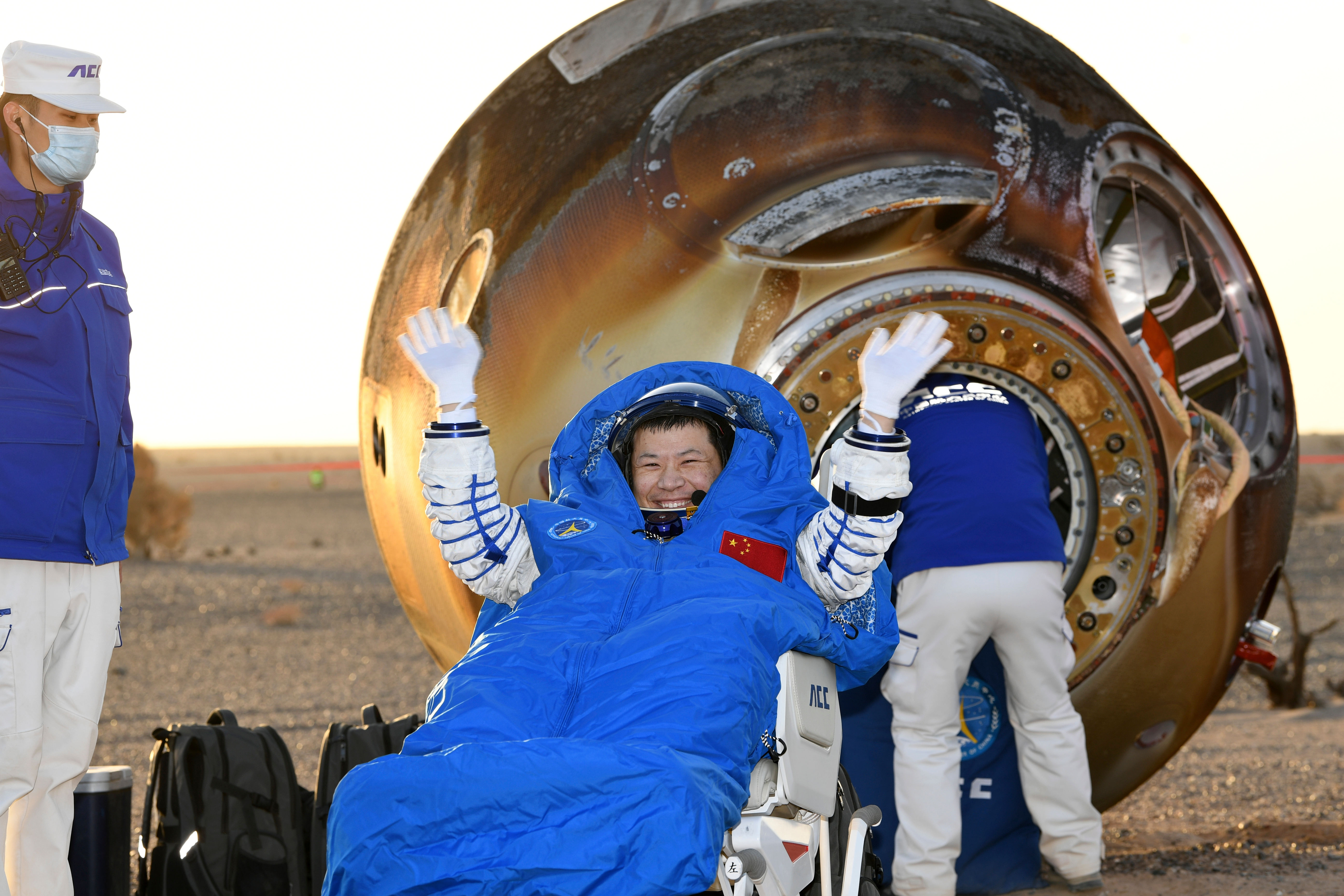 In this photo released by Xinhua News Agency, Wang Jie, a Shenzhou-20 astronaut, returns on the Shenzhou-21 spaceship's return capsule after it touched down on Earth at the Dongfeng landing site in north China's Inner Mongolia Autonomous Region, Friday, Nov. 14, 2025.