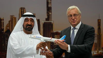 Airbus' CEO of commercial aircraft Christian Scherer presents a model of Airbus A321neo aircraft to Sheikh Ahmed bin Saeed Al Maktoum, the chairman and chief executive of Emirates and chairman of FlyDubai at a press conference to announce an order for 150 Airbus A321neo aircraft at the Dubai Air Show, United Arab Emirates, Tuesday, Nov. 18, 2025.