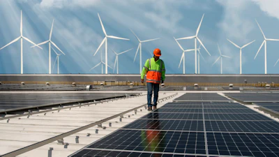 Engineer inspecting solar panels.