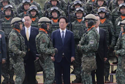 Taiwan's President Lai Ching-te, center, waits for a group photo with soldiers during the inauguration ceremony of M1A2T Abrams Main Battle Tanks in Hsinchu County, Taiwan, Friday, Oct. 31, 2025.