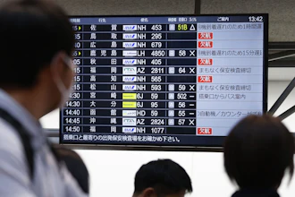 The departures display board shows All Nippon Airways' multipule flights cancellation at Haneda airport in Tokyo Saturday, Nov. 29, 2025.