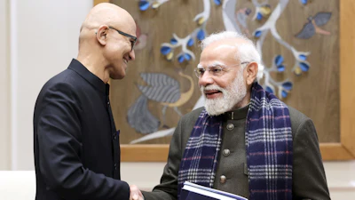 In this handout photo provided by Microsoft, Chief Executive Officer Satya Nadella, left, shakes hands with Indian Prime Minister Narendra Modi during their meeting in New Delhi, India, Tuesday, Dec. 9, 2025.